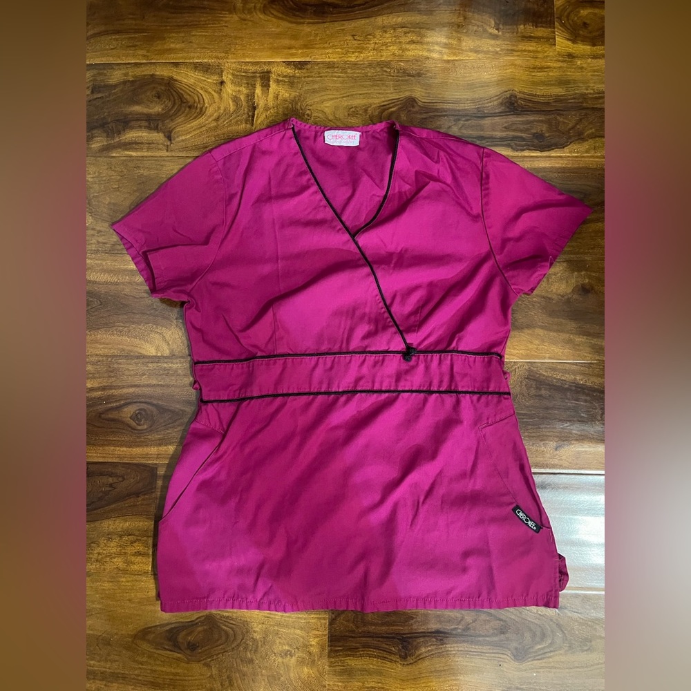 250. Beautiful and very flattering magenta scrub top